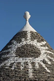 Sun painted on roof of traditional trullo in Alberobello, UNESCO World Heritage Site, Puglia, Italy, Europe Sun painted on roof of traditional trullo in Alberobello, UNESCO World Heritage Site, Puglia, Italy, Europe