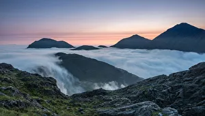 Sunrise behind Bla Bheinn and Marsco with an early morning inversion filling Glen Sunrise behind Bla Bheinn and Marsco with an early morning inversion filling Glen