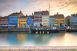 Sunrise on the colourful facades along the harbour in the district of Nyhavn, Copenhagen Sunrise on the colourful facades along the harbour in the district of Nyhavn, Copenhagen