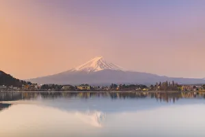 Sunrise over Mount Fuji, UNESCO World Heritage Site, reflected in Lake Kawaguchi, Japan Sunrise over Mount Fuji, UNESCO World Heritage Site, reflected in Lake Kawaguchi, Japan