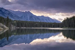 Sunrise over the mountains of the Rockies, reflected in Johnson Lake, Banff National Park Sunrise over the mountains of the Rockies, reflected in Johnson Lake, Banff National Park