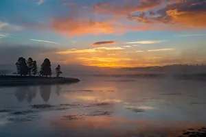 Sunrise over Yellowstone Lake with reflection, Yellowstone National Park Sunrise over Yellowstone Lake with reflection, Yellowstone National Park