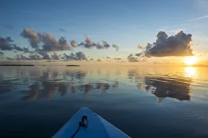 Sunset over the calm waters of Tikehau, Tuamotus, French Polynesia, Pacific Sunset over the calm waters of Tikehau, Tuamotus, French Polynesia, Pacific