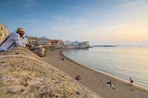 Europe Travel Photography Tips Prints: Sunset frames the beach and the turquoise sea, Gallipoli, Province of Lecce, Apulia