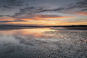 Camber Sands Beach Prints: Sunset reflections on sandy beach at sunset