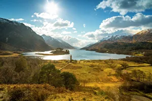 Sunshine and The Glenfinnan Monument beside Loch Shiel, Highlands, Scotland, United Kingdom Sunshine and The Glenfinnan Monument beside Loch Shiel, Highlands, Scotland, United Kingdom