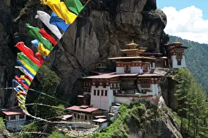Taktshang Goemba (Tigers nest monastery) with prayer flags and cliff, Paro Valley, Bhutan, Asia Taktshang Goemba (Tigers nest monastery) with prayer flags and cliff, Paro Valley, Bhutan, Asia