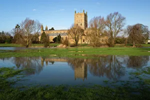 Tewkesbury Abbey reflected in flooded meadow, Tewkesbury, Gloucestershire, England Tewkesbury Abbey reflected in flooded meadow, Tewkesbury, Gloucestershire, England