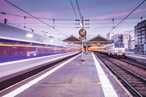 A TGV high speed train leaves the train station in Tours, Indre et Loire, Centre A TGV high speed train leaves the train station in Tours, Indre et Loire, Centre