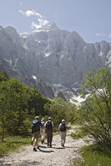 Tourist group in summer in Vrata valley walking towards Tourist group in summer in Vrata valley walking towards