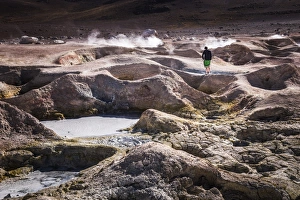 Tourist at Sol de Manana Geothermal Basin area, Altiplano of Bolivia, South America Tourist at Sol de Manana Geothermal Basin area, Altiplano of Bolivia, South America