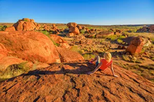 Tourist woman on the top view of Karlu Karlu (Devils Marbles) Conservation Reserve Tourist woman on the top view of Karlu Karlu (Devils Marbles) Conservation Reserve