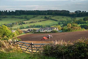 Prints of Tractor ploughing fields in Blockley, The Cotswolds, Gloucestershire, England, United Kingdom, Europe Gloucestershire Prints: Tractor Ploughing Fields in Blockley Print