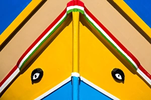 Detail of traditional brightly painted fishing boat in the harbour at Marsaxlokk