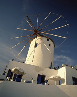 Traditional thatched windmill in the village of Oia Traditional thatched windmill in the village of Oia