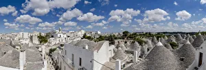 Trulli traditional stone huts and Itria Valley in summer, Alberobello Trulli traditional stone huts and Itria Valley in summer, Alberobello