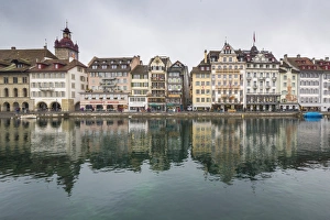 The typical buildings of the old medieval town are reflected in River Reuss, Lucerne The typical buildings of the old medieval town are reflected in River Reuss, Lucerne