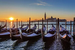 Venetian winter sunrise after snow with gondolas, San Giorgio Maggiore and Lido, Venice Venetian winter sunrise after snow with gondolas, San Giorgio Maggiore and Lido, Venice