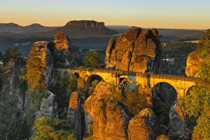 View from Bastei Bridge at sunrise to Lilienstein Mountain, Elbsandstein Mountains View from Bastei Bridge at sunrise to Lilienstein Mountain, Elbsandstein Mountains