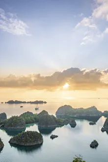 View over a bay of islands at dawn from the Piaynemo lookout, Raja Ampat, West Papua View over a bay of islands at dawn from the Piaynemo lookout, Raja Ampat, West Papua