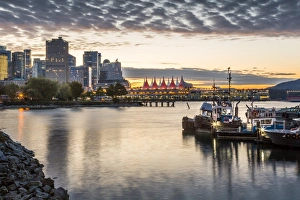 View of Canada Place and urban office buildings at sunset from CRAB Park, Vancouver View of Canada Place and urban office buildings at sunset from CRAB Park, Vancouver