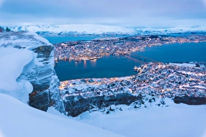 View of the city of Tromso at dusk from the mountain top reached by the Fjellheisen cable car View of the city of Tromso at dusk from the mountain top reached by the Fjellheisen cable car