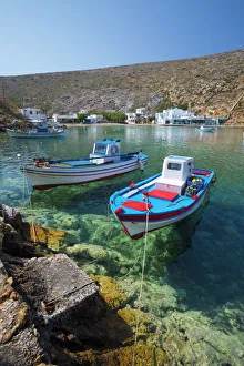 View over crystal clear water and fishing boats in harbour, Cheronissos, Sifnos, Cyclades View over crystal clear water and fishing boats in harbour, Cheronissos, Sifnos, Cyclades