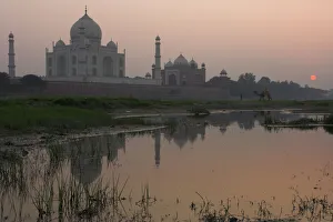 View at dusk across the Yamuna river of the Taj Mahal View at dusk across the Yamuna river of the Taj Mahal