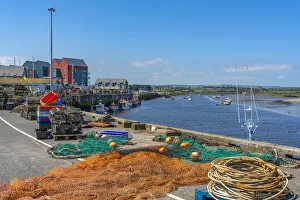 View of fishing nets on quayside and River Coquet at Amble, Morpeth, Northumberland View of fishing nets on quayside and River Coquet at Amble, Morpeth, Northumberland