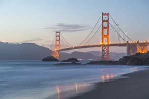 View of Golden Gate Bridge from Baker Beach at dusk, South Bay, San Francisco, California View of Golden Gate Bridge from Baker Beach at dusk, South Bay, San Francisco, California
