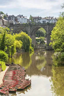 View of Knaresborough viaduct and the River Nidd with town houses in the background View of Knaresborough viaduct and the River Nidd with town houses in the background