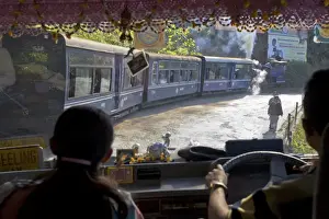 Colourful Street Photography Prints: View looking through windscreen of bus at Steam train (Toy Train), Darjeeling
