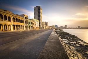 View along The Malecon at dusk showing mix of old and new buildings, Havana View along The Malecon at dusk showing mix of old and new buildings, Havana