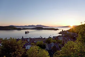 View over Oban Bay from McCaigs Tower, sunset, ferry coming into port, Oban, Argyll and Bute, Scotland, United Kingdom View over Oban Bay from McCaigs Tower, sunset, ferry coming into port, Oban, Argyll and Bute, Scotland, United Kingdom
