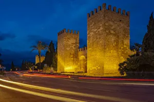 View of Old Town Gate and fortified walls in the old town at dusk, Alcudia, Majorca, Balearic Islands, Spain View of Old Town Gate and fortified walls in the old town at dusk, Alcudia, Majorca, Balearic Islands, Spain