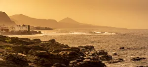 View of rocky coastline and Atlantic sea at sunset near El Pagador, Las Palmas, Gran Canaria, Canary Islands, Spain View of rocky coastline and Atlantic sea at sunset near El Pagador, Las Palmas, Gran Canaria, Canary Islands, Spain