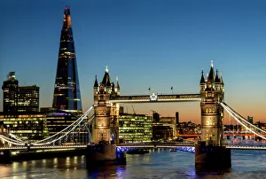View of the Shard and Tower Bridge standing tall above the River Thames at dusk, London View of the Shard and Tower Bridge standing tall above the River Thames at dusk, London