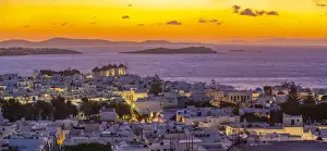 Greek Island Views Prints: View of windmills and Aegean Sea from elevated position at sunset, Mykonos Town, Mykonos