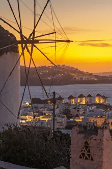 View of the windmills and town from elevated position at dusk, Mykonos Town, Mykonos View of the windmills and town from elevated position at dusk, Mykonos Town, Mykonos