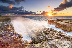 Caribbean Coastal Scenery Prints: Waves crashing on cliffs at sunrise, Devils Bridge, Antigua, Antigua and Barbuda