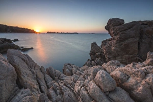 White cliffs and blue sea framed by the lights of sunset Santa Teresa di Gallura White cliffs and blue sea framed by the lights of sunset Santa Teresa di Gallura