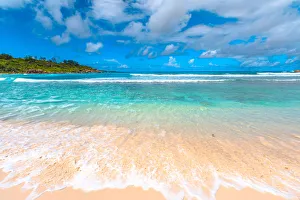 White sandy beach and turquoise clear sea of Anse Cocos, La Digue, Seychelles, Indian White sandy beach and turquoise clear sea of Anse Cocos, La Digue, Seychelles, Indian