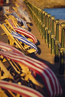 Beach Huts In England Prints: Windblown deckchairs on seafront, Sidmouth, Devon, England