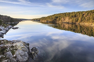 Woods reflected in the calm waters, Hitra Island, Trondelag, Norway, Scandinavia, Europe Woods reflected in the calm waters, Hitra Island, Trondelag, Norway, Scandinavia, Europe