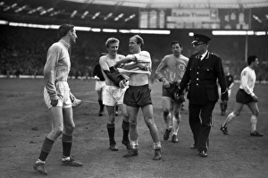 Club teammates Denis Law and Bobby Charlton exchange shirts during the 1965 Club teammates Denis Law and Bobby Charlton exchange shirts during the 1965
