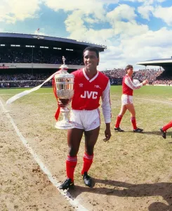 Athletic Prints: Arsenal's David Rocastle holds the League Cup trophy in 1987 Print