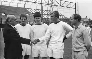 Prints of Football - 1969 / 1970 season Tranmere Rovers manager Dave Russell meets his players. (l-r): Frank Gill, Raymond Pointon, M Fleming and trainer Jackie Wright (who later became manager himself) Sport Prints: Dave Russell Tranmere Rovers Football Print 1969/1970