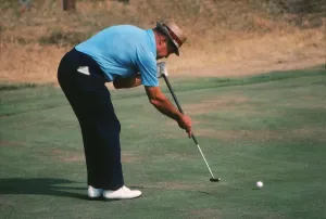 Golfing Legends Of The 70s Prints: Sam Snead demonstrating his split-grip, side-saddle putting technique