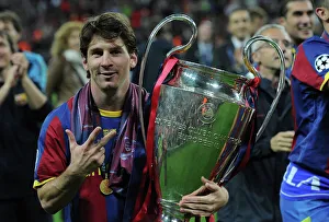 Lionel Messi with the 2011 Champions League trophy Lionel Messi with the 2011 Champions League trophy