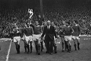The Manchester United team do a lap of honour with manager Matt Busby after winning the The Manchester United team do a lap of honour with manager Matt Busby after winning the